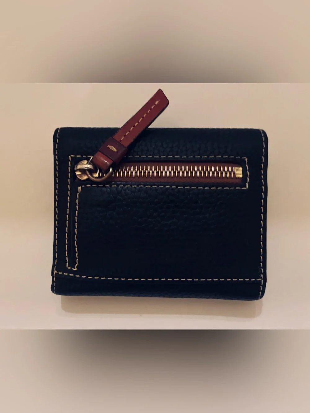 Dooney & Bourke Black Pebbled Leather Wallet with Brown Trim and Gold Plaque